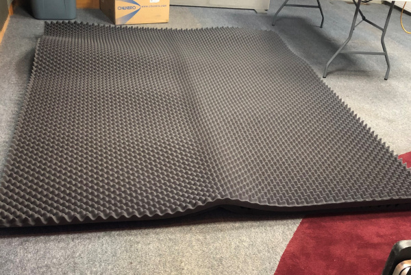 Acoustic foam pad on floor